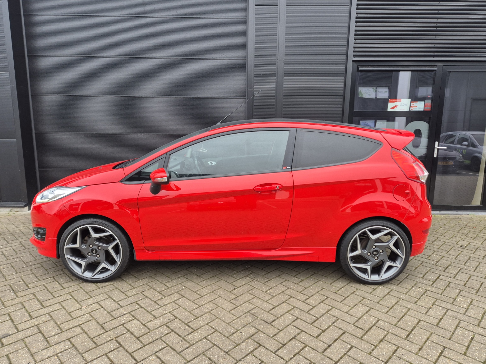 Ford Fiesta 1.25i ST-Line / 2015 / Airco / Cruise Control / Stoelverwarming / Led / 18 inch / Racing Red - Afbeelding 8